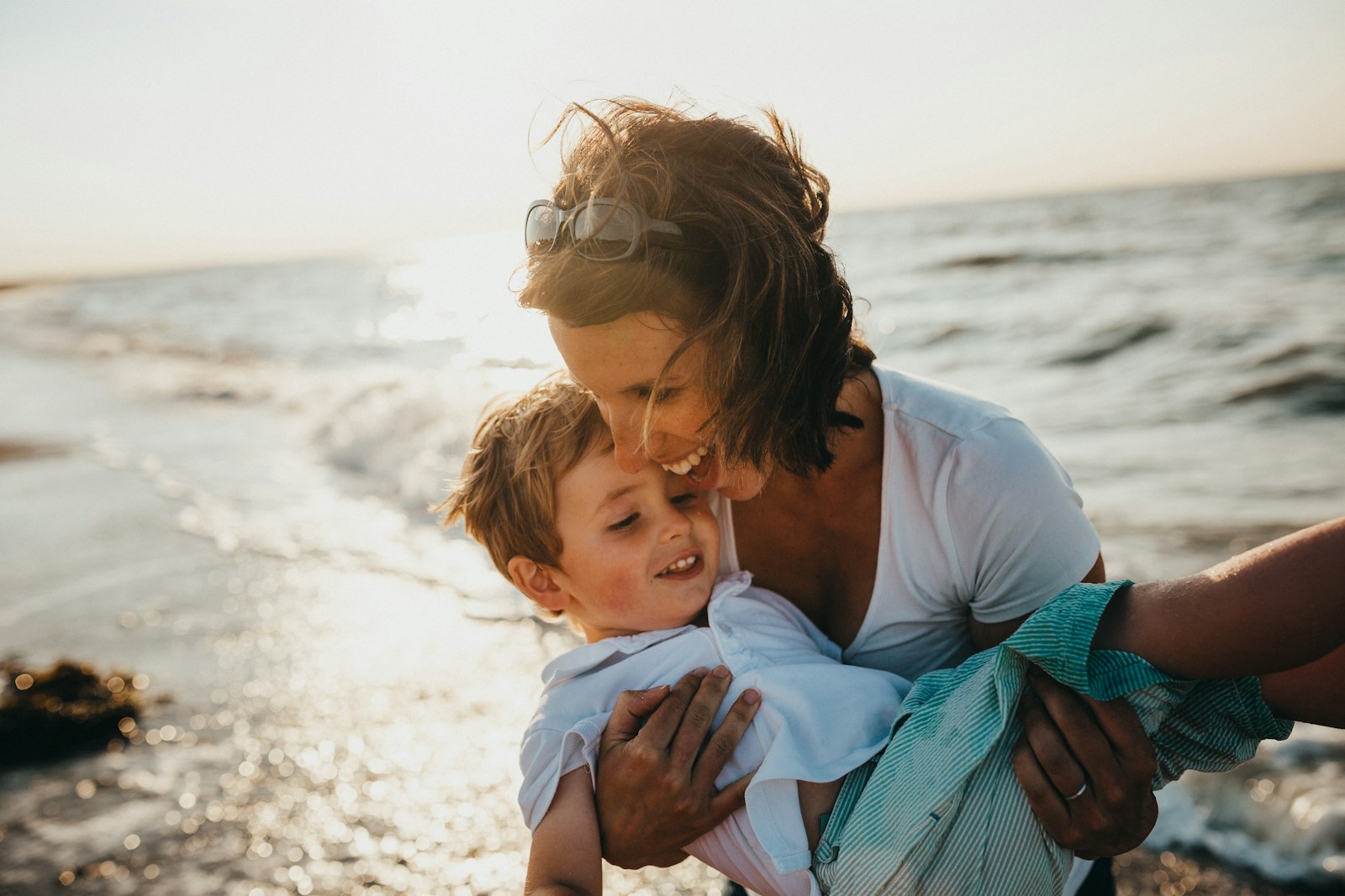 Mother embracing her child — NORA AI safety watch protects what matters most